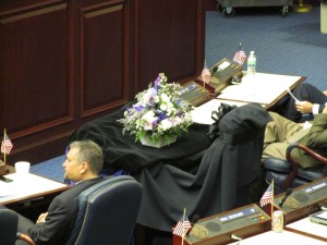 Black crepe covers the desk of Rep. Clay Ford.